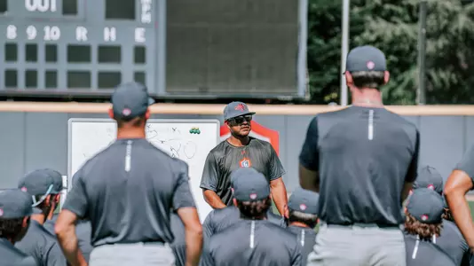 Coach Valenzuela speaks to team at fall practice