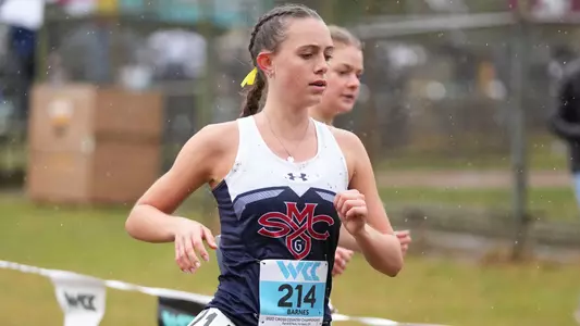 Kaylee Barnes running in the rain