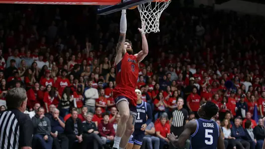 Logan Johnson skies for a layup vs. BYU