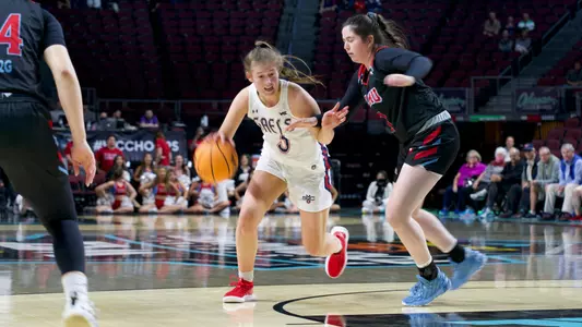 Leia Hanafin dribbles through traffic at the 2022 WCC Tourney
