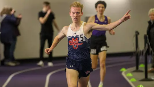 Thomas Osborne crosses line at Portland Indoor One with arm raised