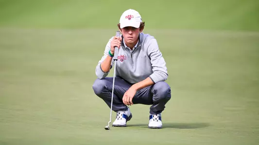 Mitchell Hoey preparing for a putt