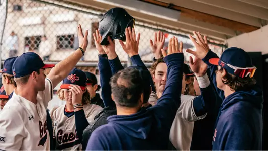 team celebrates scoring vs. Xavier