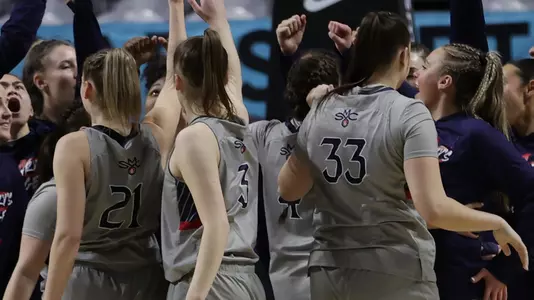 Team huddle before WCC Tournament game