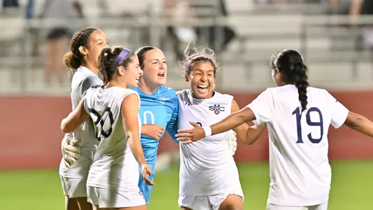 Group celebration win over Wash St.