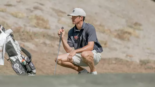 Connor Reis lines up a putt