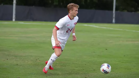 Timothy Stephens dribbles upfield