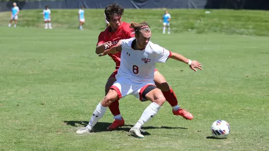 Storm Hollensted shielding off a defender