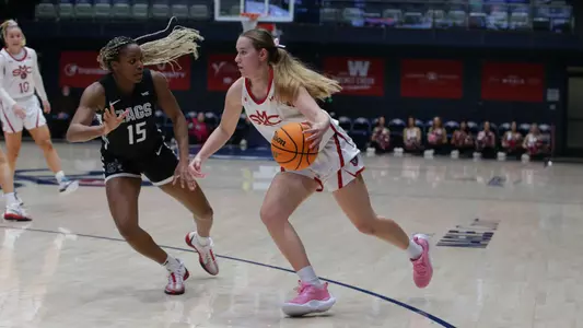 Emily Foy dribbles around a Gonzaga defender