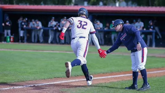 Connor Harrison rounds the bases after a two-run homer