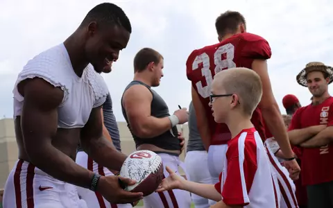 Special Smiles Abound at Sooners Practice