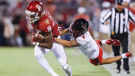 Tenth-Ranked Sooners Run Past Texas Tech, 49-27