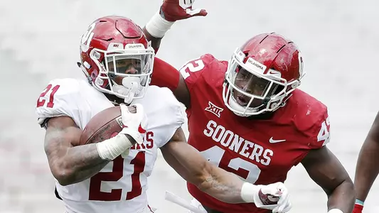 White Edges Red in Blustery Spring Game