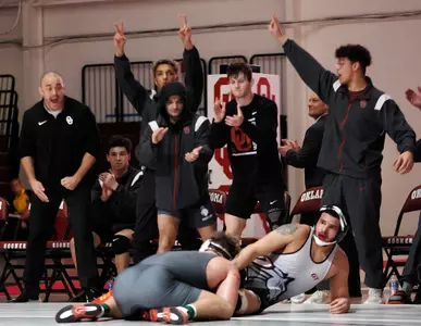 Carson Berryhill takes Asa Terrel down with less than 30 seconds remaining in his final bout at McCasland Field House.