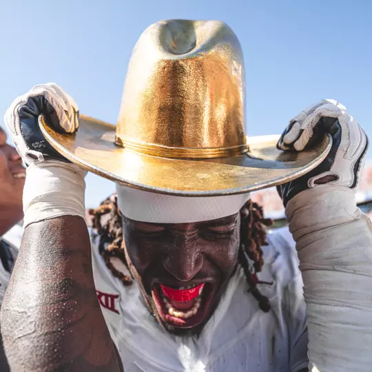 Oklahoma lineman Tyler Guyton celebrates with the Golden Hat trophy after Oklahoma defeats Texas 34-30 in the annual Red River Rivalry Game on Oct. 7, 2023 in Cotton Bowl Stadium in Dallas, TX. (Photo by Morgan Givens/Oklahoma Athletics)