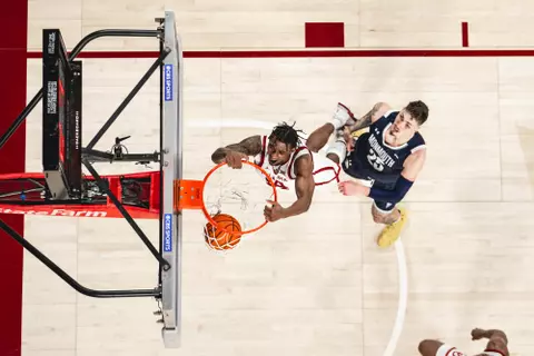 Oklahomaās Jalon Moore dunks during a game against Monmouth on Dec. 31, 2023 in the Lloyd Noble Center in Norman, OK. (Photo by Morgan Givens/Oklahoma Athletics)