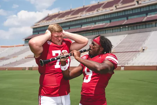 NORMAN, OK - August 05, 2024 - Oklahoma Offensive lineman Jacob Sexton (#76) and Oklahoma Defensive back Gentry Williams (#9) during Oklahoma Sooners Football Throwback Uniform photoshoot in Norman, OK. Photo By Morgan Givens/University of Oklahoma