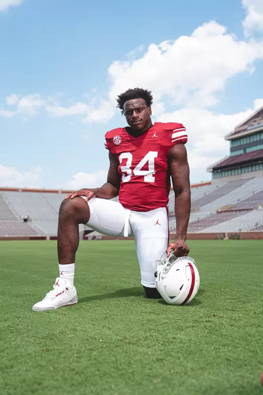 NORMAN, OK - August 05, 2024 - Oklahoma Defensive Lineman Adepoju Adebawore (#34) during Oklahoma Sooners Football Throwback Uniform photoshoot in Norman, OK. Photo By Morgan Givens/University of Oklahoma