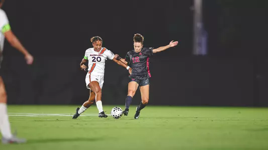 Alexis Washington dribbles the ball up the field in a game against Auburn