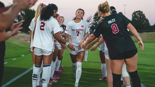 Michelle Pak runs through the lineup tunnel prior to a game against No. 4 Tennessee