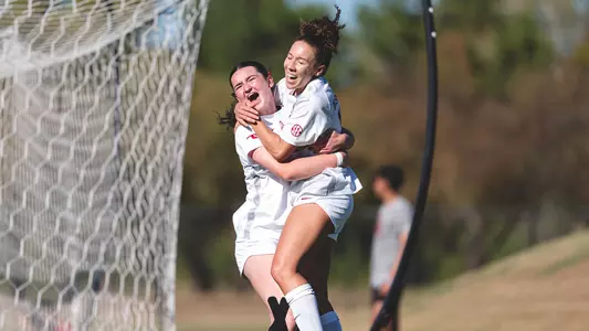 Alexis Washington celebrates a game-winning goal with Sophie Morrin in a win against Texas