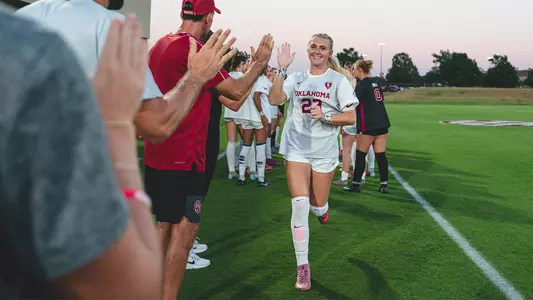 Cassie Clifton high fives her teammates prior to the game against Tennessee