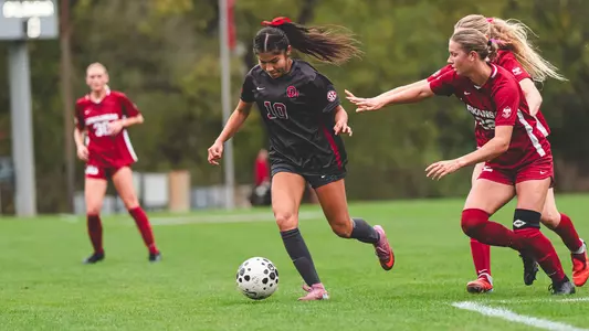 Juliette Rayo dribbles the ball up the field against Arkansas