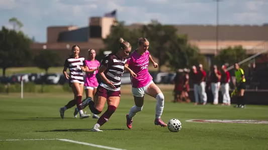 Emily Davey dribbles the ball up field against Texas A&M