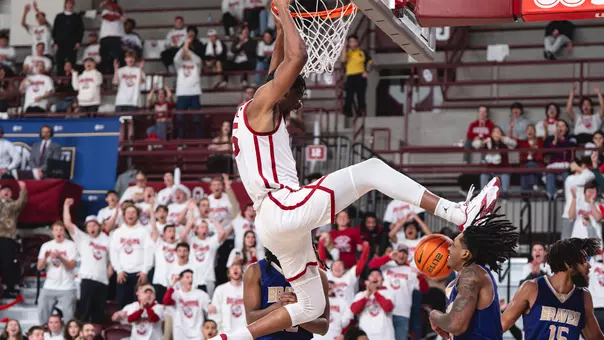 Mohamed Wague dunks during a game at McCasland Field House in 2024.