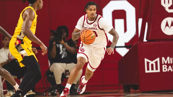 Tae Davis dribbles the ball up the court in Tuesday's win vs. APBU
