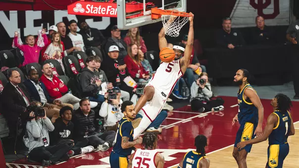 Mohamed Wague dunks during a win against Kansas City