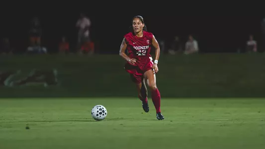 Riley Brown dribbles the ball up the field during a game against Oklahoma State