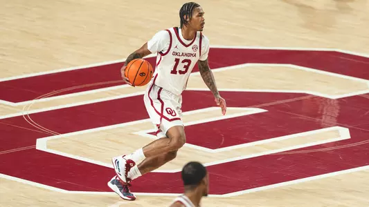 Tae Davis brings the ball up the court during the win against Kansas City.