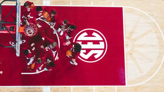 OU men's basketball gathered pre-game against Kansas City