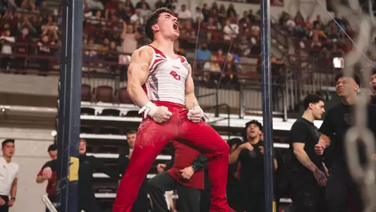 Francisco Velez Belendez celebrates his rings routine after dismount
