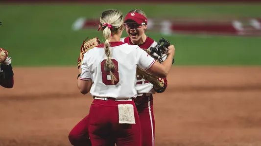 Isabella Smith and Hannah Coor hugging after a win against South Carolina