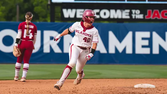 Gabbie Garcia rounding second base after hitting a game winning home run