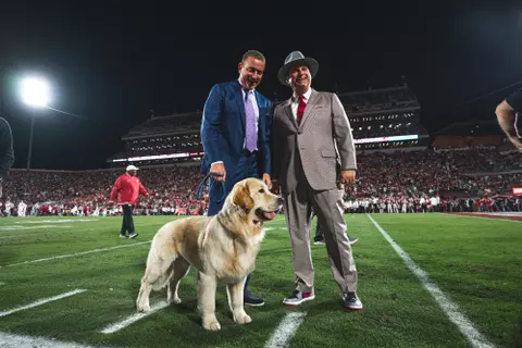 NORMAN, OK - November 23, 2024 - Joe Castiglione, Kirk Herbstreit and his dog Peter during the game between the Alabama Crimson Tide and the Oklahoma Sooners at Gaylord Family - Oklahoma Memorial Stadium in Norman, OK. Photo By Morgan Givens/University of Oklahoma