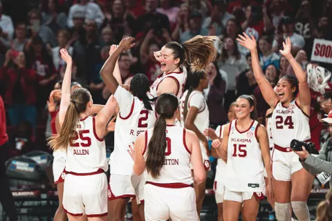 NORMAN, OK - March 24, 2025 - Oklahoma Guard Payton Verhulst (#12) and team celebrate during the NCAA Womenās Basketball Tournament Round of 32 game between the Iowa Hawkeyes and the Oklahoma Sooners at Lloyd Noble Center in Norman, OK. Photo By Morgan Givens/University of Oklahoma