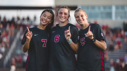 Hadley Murrell, Michelle Pak and Kayla Keefer pregame against North Texas