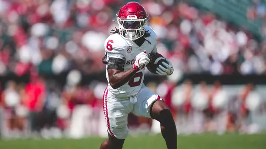 Tory Blaylock takes a handoff in a game at Temple