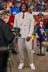 R Mason Thomas' at SEC media days poses for photo in suit
