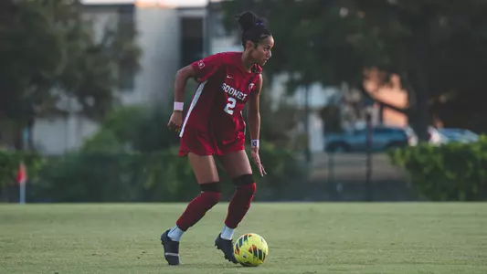 Naomi Clark dribbling the ball against Texas State