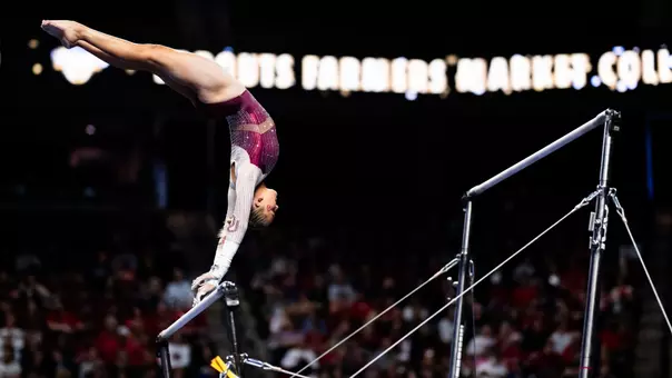 Ella Murphy swings on the bars during the Sprouts Collegiate Quad