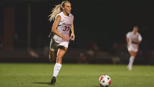 Picture of Elle Canty dribbling the ball up the field during a game against Ole Miss
