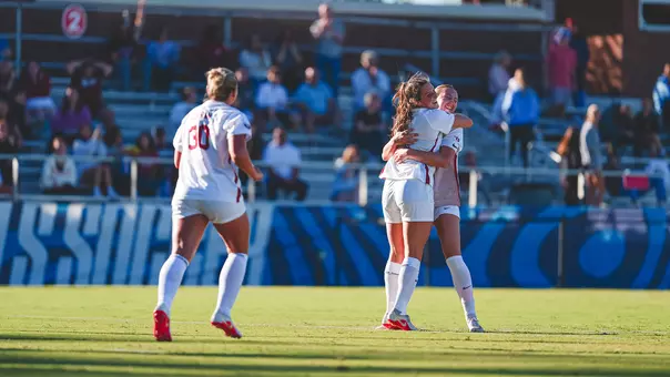 Picture of Kayla Keefer and Paige Califf hugging after a goal