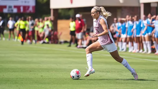 Elle Canty dribbles the ball up the field