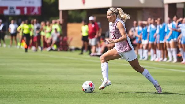 Elle Canty dribbles the ball up the field