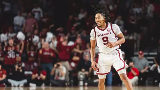 Nigel Pack in white uniform on a basketball court