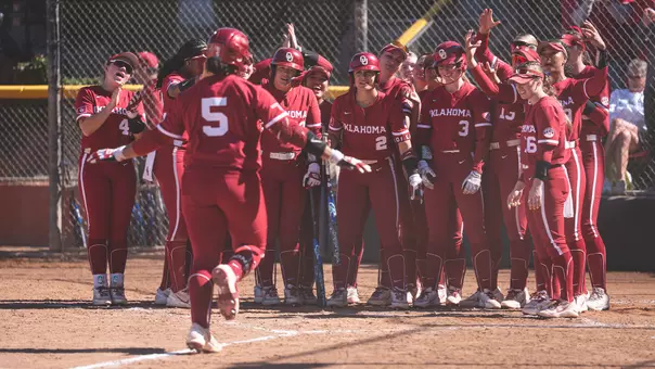 Ella Parker rounds third base after a home run against Washington
